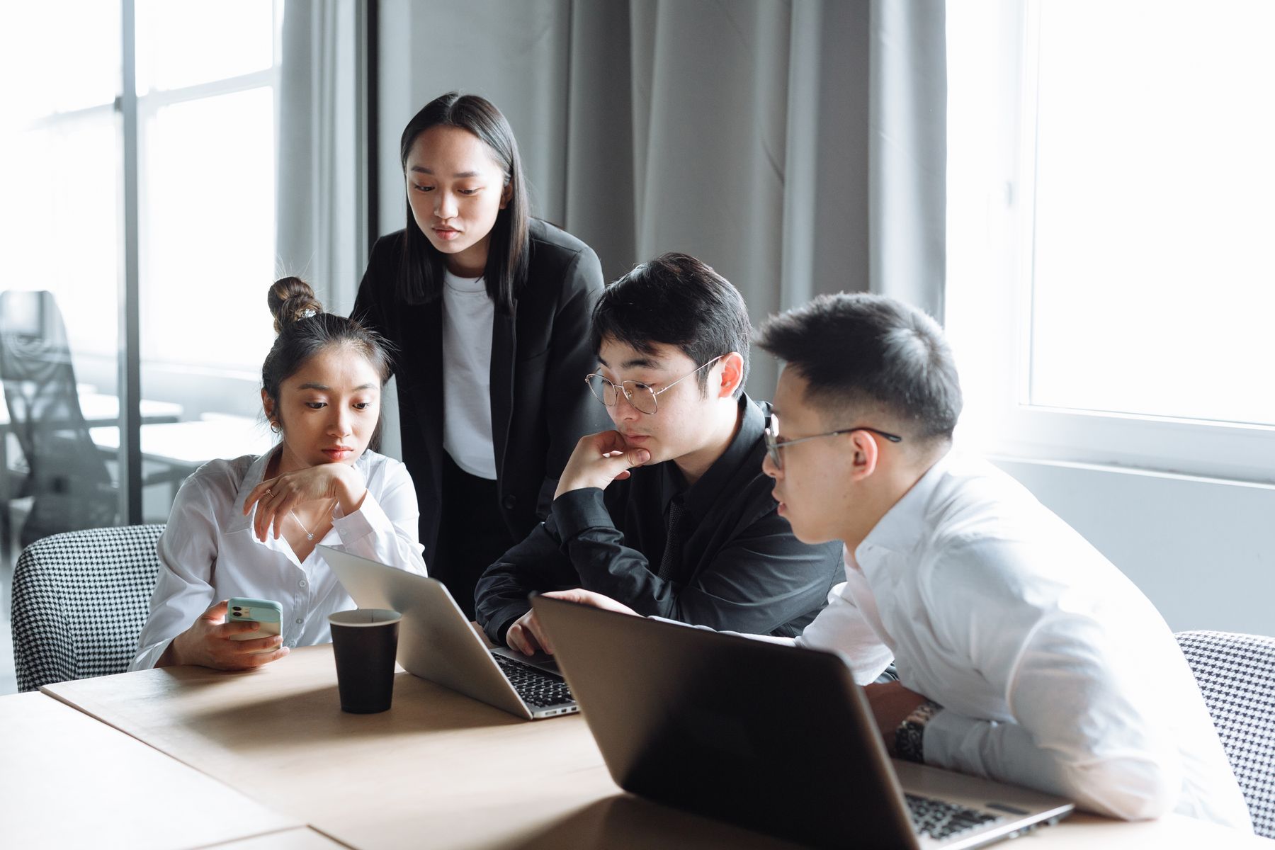 Asian colleagues working together around a table
